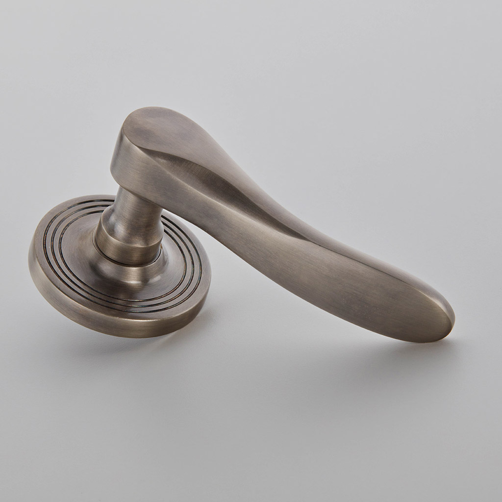 Cambridge Door Handle on Reeded Covered Rose