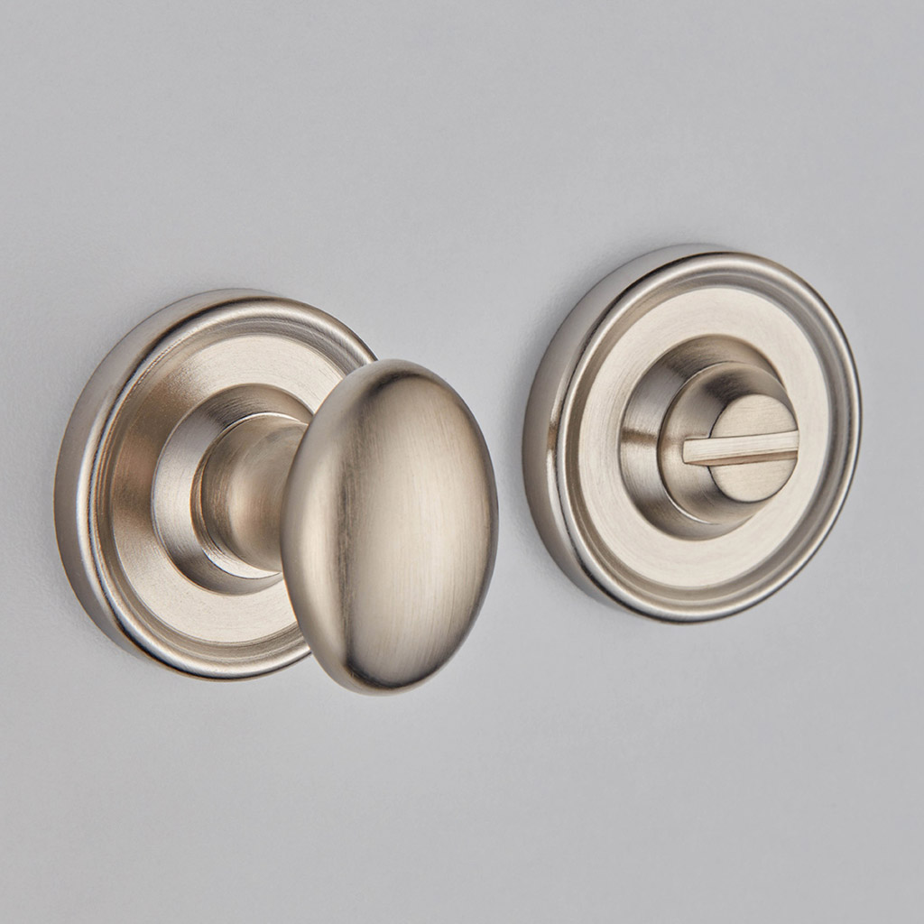 Oval Knob Turn And Release On Raised Edge Covered Rose