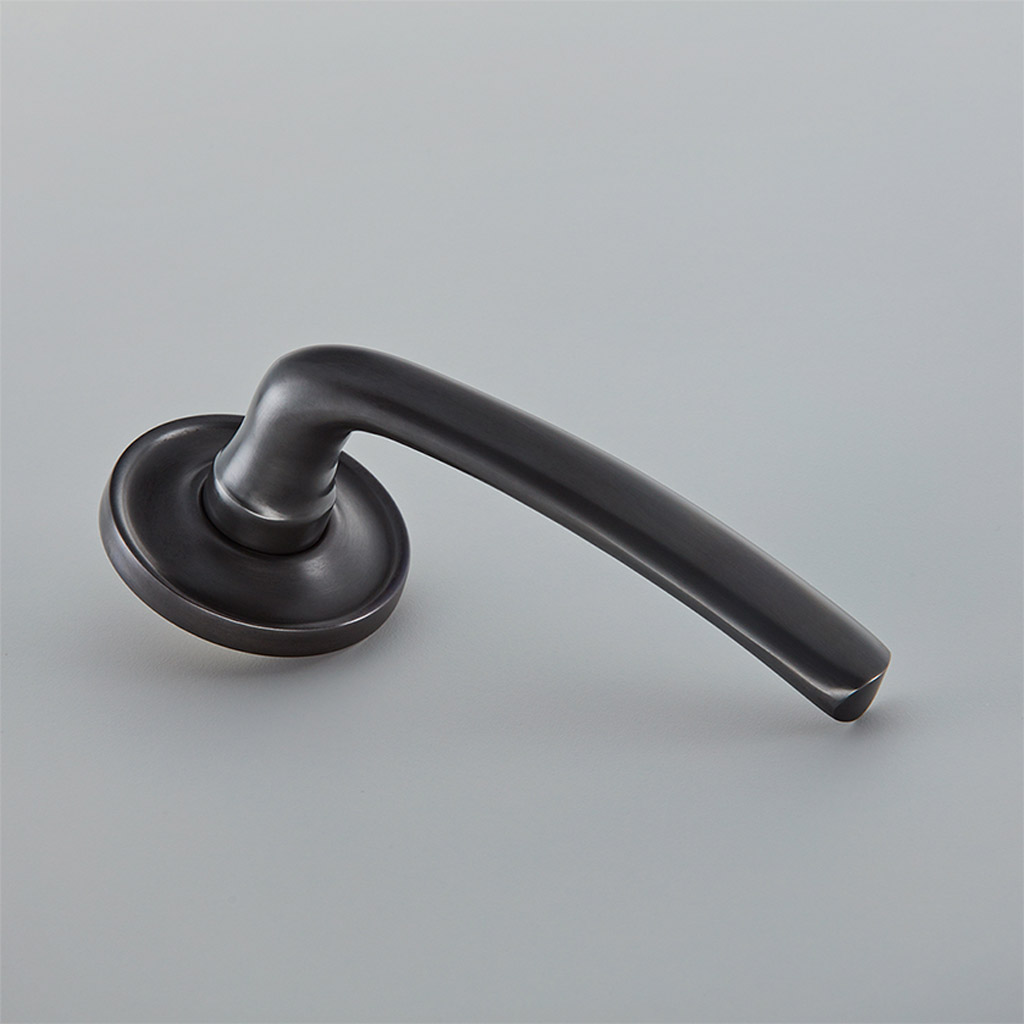 Floe Door Handle on Raised Edge Covered Rose