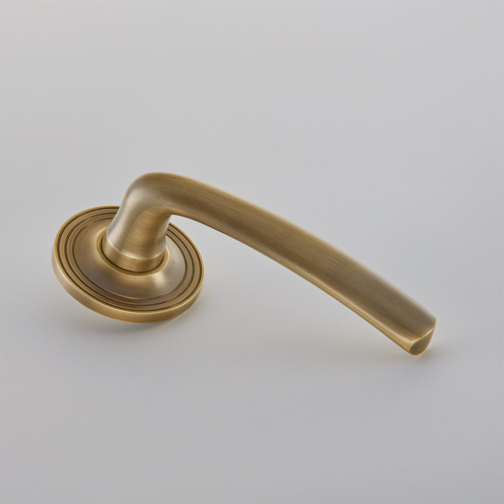 Floe Door Handle on Reeded Edge Covered Rose
