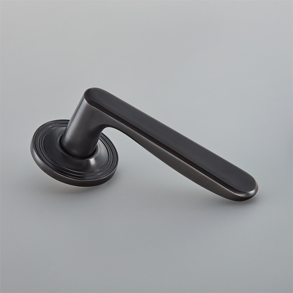 Velo Door Handle on Reeded Covered Rose